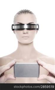 Cyber woman holding silver gadget