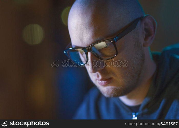 cybercrime, hacking and people concept - close up of bald hacker in glasses. close up of bald hacker in glasses . close up of bald hacker in glasses