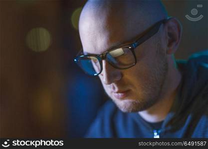 cybercrime, hacking and people concept - close up of bald hacker in glasses. close up of bald hacker in glasses . close up of bald hacker in glasses