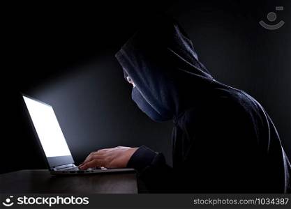 Cybercrime, hacking and technology crime. hacker with laptop. with clipping path.
