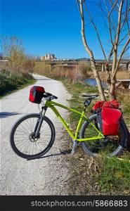 cycling tourism MTB bike in Ribarroja Parc de Turia with paniers and saddlebag