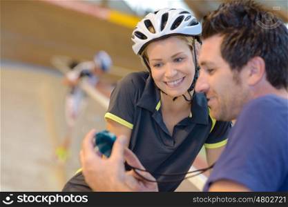 Cyclist pleased with time on stopwatch