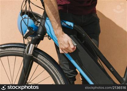 cyclist securing e bike battery