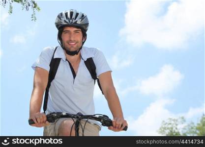 Cyclist wearing a helmet