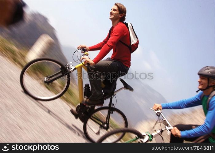 Cyclists riding bikes on an open road