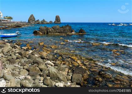 Cyclopean Coast and the Islands of the Cyclops on Aci Trezza town (Italy, Sicily,10 km north of Catania). Known as Isoles Dei Ciclopi Faraglioni.