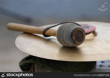 Cymbal and a drum stick .