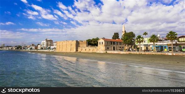 Cyprus island. Capital city Larnaca. Charming downtown promenade with old fortress and minaret tower. Travel in Cyprus island. Larnaca town