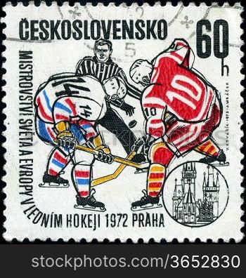 CZECHOSLOVAKIA - CIRCA 1972: A stamp printed in the Czechoslovakia, dedicated to World and European Ice Hockey Championships, Prague, shows two hockey player and hockey referee, circa 1972