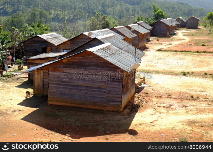 DA LAT, VIET NAM- DEC 30: Amazing scene at Dalat countryside, group of wooden house among agriculture field, housing for settle of poor Vietnamese, landscape of poverty residence, Vietnam, Dec 30,2015