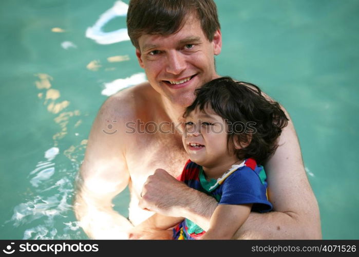 Dad and child in swimming pool