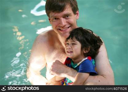 Dad and child in swimming pool