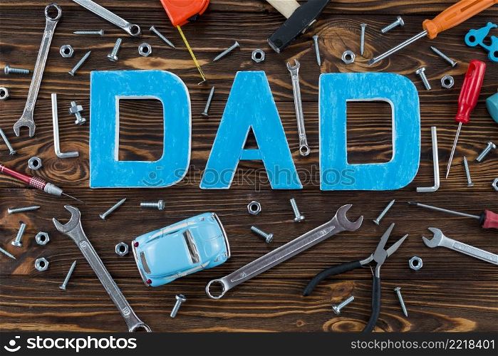 dad inscription with tools toy car