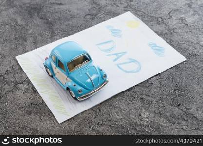 dad inscription with toy car