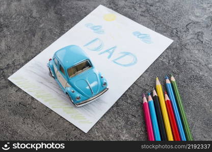 dad inscription with toy car pencils