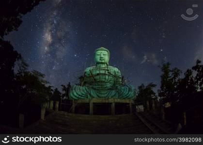 Daibutsu or &rsquo;Giant Buddha&rsquo; is a Japanese term often used informally for a large statue of Buddha, Time lapse Giant Buddha with milky way moving in sky at night, Mae Tha District, Lampang Province.. Daibutsu or &rsquo;Giant Buddha&rsquo;.