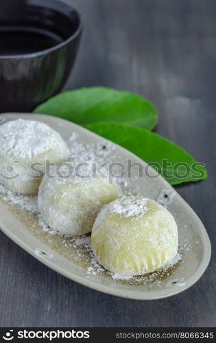 Daifuku Mochi Japanese dessert on dish with hot tea , still life