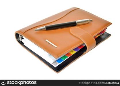 Daily planner with pen on a white background