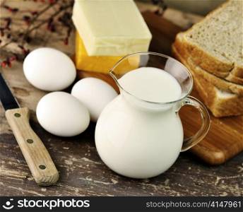 dairy products and Fresh eggs on a old wooden table