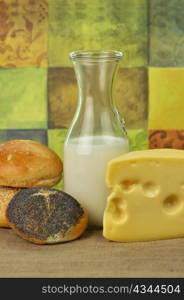 Dairy products arrangement - milk , cheese and bread rolls