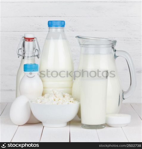 Dairy products isolated on white wooden table