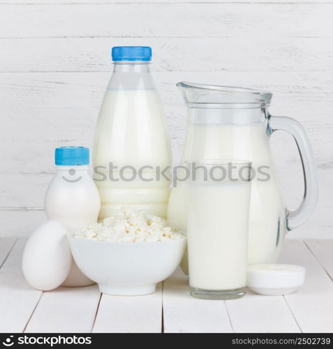 Dairy products on white wooden table
