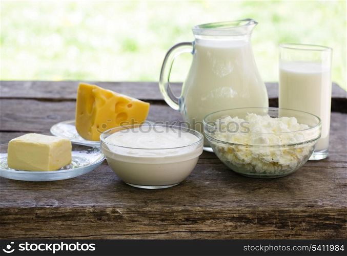 Dairy products on wooden table, selective focus, shallow deep of field