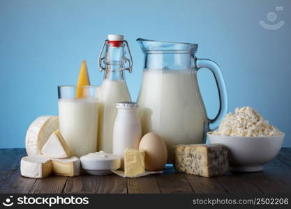 Dairy products on wooden table still life