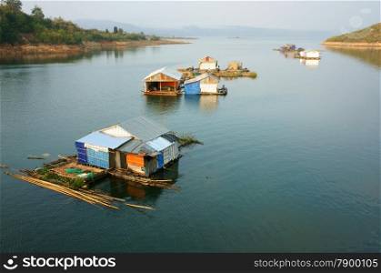 DAKLAK, VIET NAM- FEB 26: Asian residence on water, group of floating house of fishing village, beautiful Vietnamese countryside, impression panoramic, Dak Lak, Vietnam, Feb 26, 2015