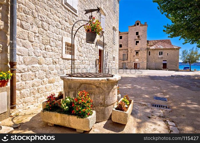 Dalmatian stone architecture and ancient well in Kastel Stafilic, Split region in Croatia
