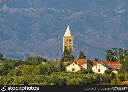 Dalmatian village of Zaton church tower and Velebit mountain, Croatia