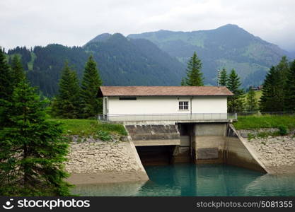 Dam and small house in the valley in Lichtenstein