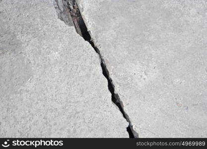 Damaged concrete construction with crack, copyspace. Damaged concrete construction with crack, copyspace top view