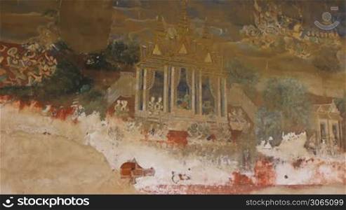 Damaged paintings on the walls surrounding the Royal Palace in Phnom Penh, Cambodia, Asia. Sequence