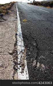 Damaged road grunge paint weathered in Canary Islands