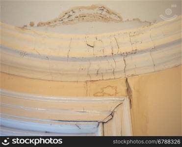 Damp moisture damage. Damage caused by damp and moisture on a wall and ceiling