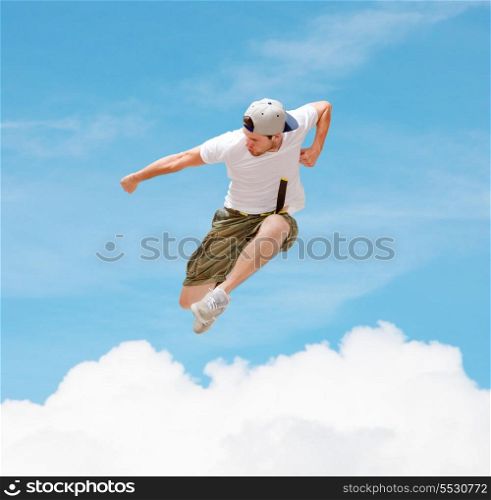 dance and fitness concept - male dancer jumping in the air