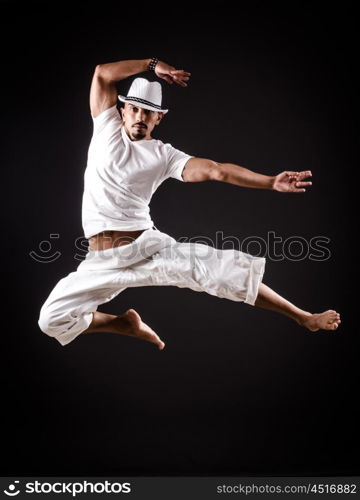 Dancer dancing dances in white clothing