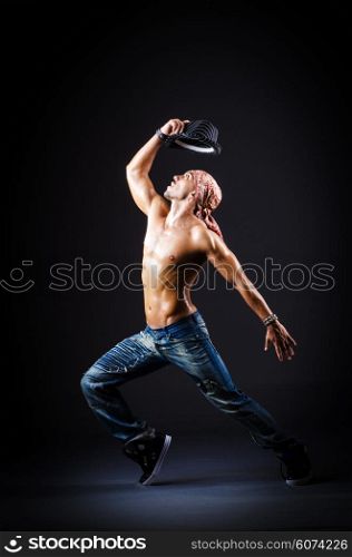 Dancer dancing in dark room