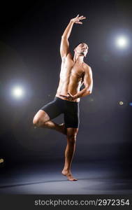 Dancer dancing in the dark studio