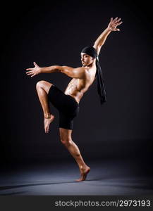 Dancer dancing in the dark studio