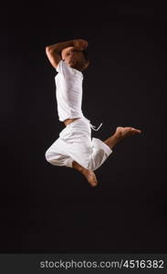 Dancer dancing in the dark studio