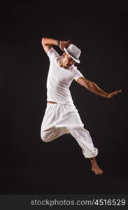 Dancer dancing in the dark studio