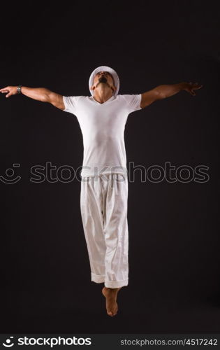 Dancer dancing in the dark studio