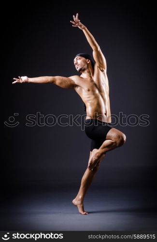 Dancer dancing in the dark studio