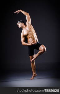 Dancer dancing in the dark studio