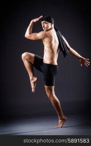 Dancer dancing in the dark studio