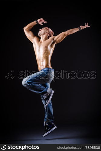 Dancer dancing in the dark studio