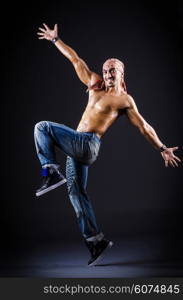 Dancer dancing in the dark studio