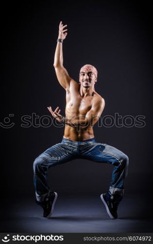 Dancer dancing in the dark studio